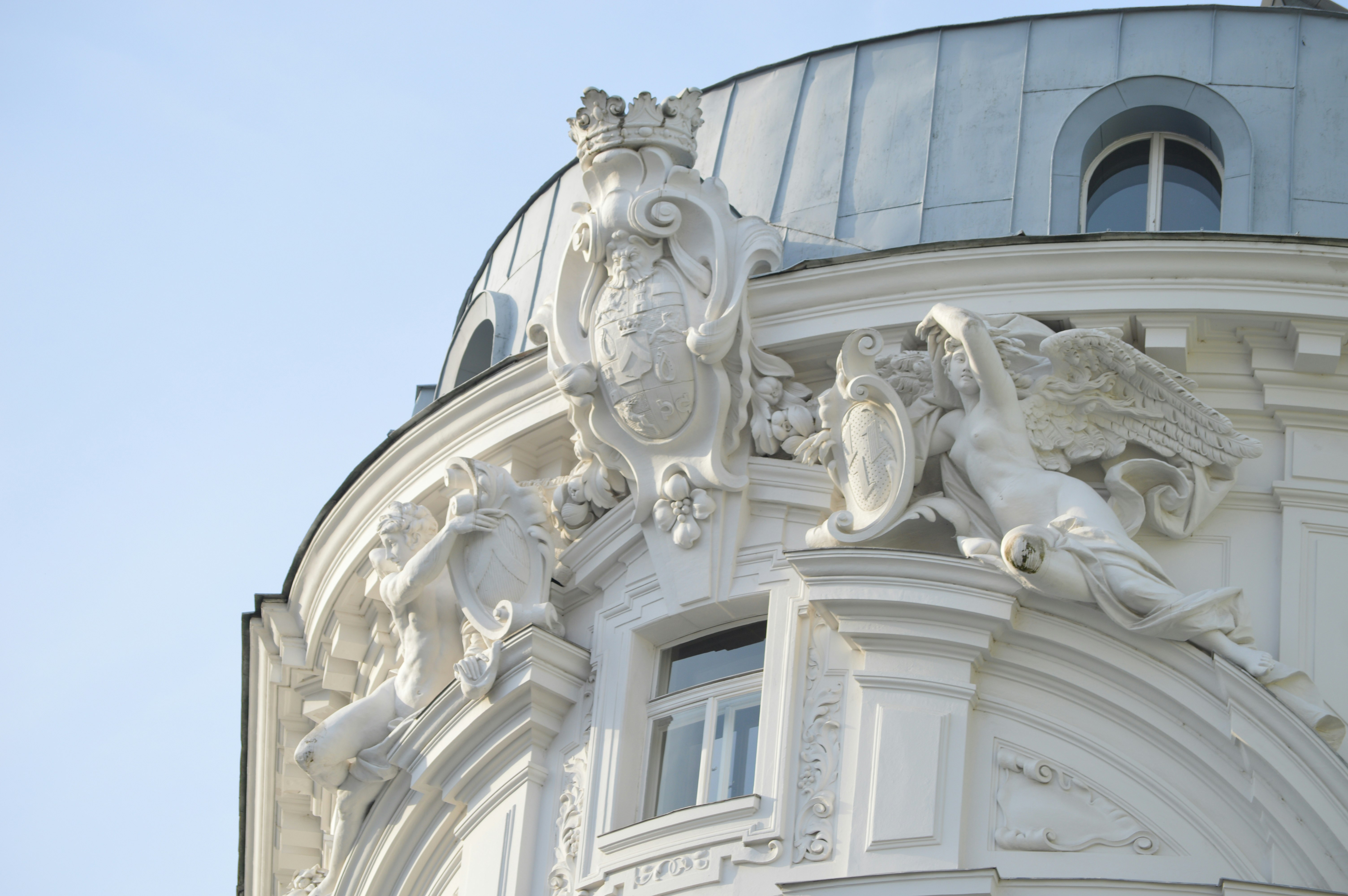 A building with statues on the top of it